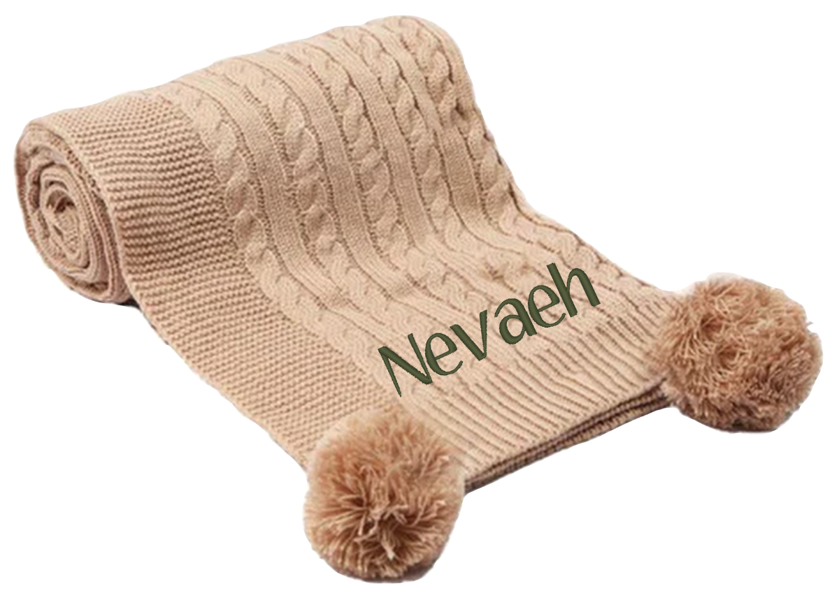 Treat a special little boy or girl to the perfect gift! Our exclusive baby cable knitted pom pom blanket, in stunning Coffee Brown, is customised with his or her name and desired font style and colour. Soft and cuddly, it's ideal for any cot or pram and measures 70 x 100 cm. Make him or her feel extra special with a personalised embroidered baby coffee brown cable knitted blanket!