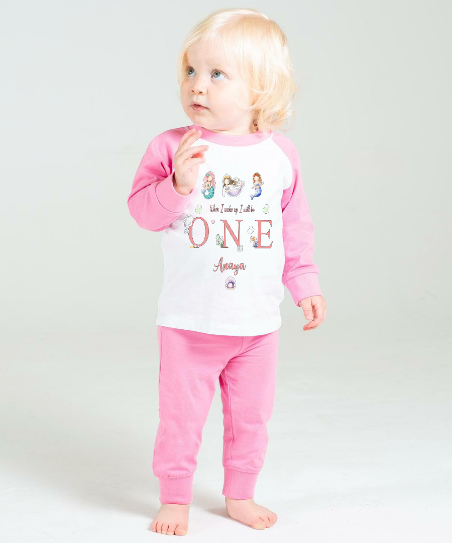 Indulge your little mermaid princess with our luxurious Mermaid, Under the Sea inspired When I Wake Up Pyjamas, adorned with beautiful Mermaids, Seashells, Dolphin, Fish &amp; Coral designs. Available in Solid Pink &amp; White or Pink Candy Striped &amp; White, these cotton PJs feature a bold, vibrant print and a delicate and exclusive Mermaid, Under the Sea Design. Give the gift of exquisite sleepwear with these PJs, perfect for a special birthday celebration.