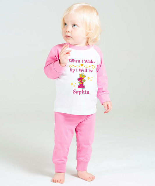 Searching for the perfect wake up PJs for your little girl? Look no more! Our one-of-a-kind "When I Wake Up"&nbsp; Princess Age design set is the perfect addition to any birthday bash. Personalized with a name and princess themed age, these jammies come in both Solid Pink &amp; White, Pink Candy Striped &amp; White.&nbsp;  Enhance your sleepwear with our exquisite Princess Themed Age Design.  Made with 100% cotton and a bold print, these PJs make a fab birthday present!