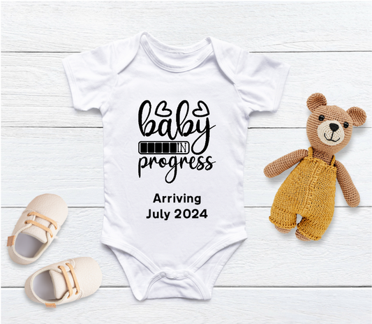 Capture your pregnancy announcement with this adorable personalised Baby in Progress baby grow! Personalised with Arrival Month; Year. Inform all your family, friends and even the world in the best way possible with a personalised short sleeved bodysuit. Share your excitement on social media platforms with the unique touch of a custom baby bodysuit. It also makes for the perfect baby shower gift.
