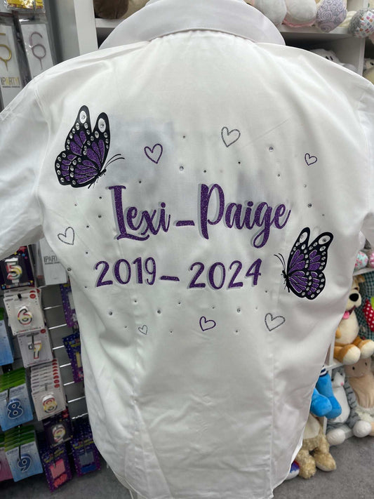 Sprinkle some sparkle onto the end of the school year with these custom Signing Shirts for the Class of 2025! These shirts feature a dazzling Glitter &amp; Diamanté Butterfly Design, complete with glitter hearts and personalized with your name and important dates. The perfect way to remember all the fun and memories of your last day of school.

Enhance your leavers shirt with your own personal touch by adding custom feather trims and bows. Create a truly unique and eye-catching garment that will make a last