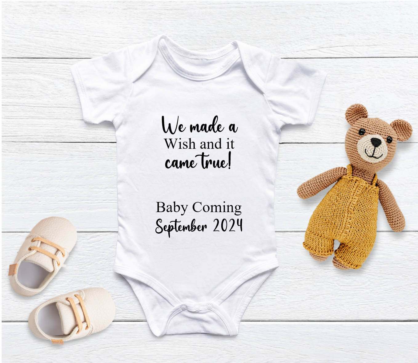 Capture your pregnancy announcement with this adorable personalised We Made A Wish baby grow! Personalised with Arrival Month &amp; Year. Inform all your family, friends and even the world in the best way possible with a personalised short sleeved bodysuit. Share your excitement on social media platforms with the unique touch of a custom baby bodysuit. It also makes for the perfect baby shower gift.