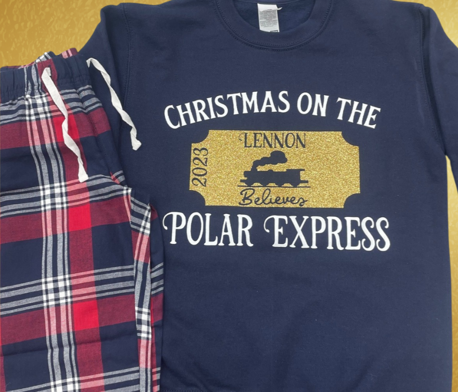 Experience the holiday spirit in style with these customisable Christmas 
family matching pyjamas sets inspired by the Polar Express! Made with 
100% cotton, these adorable matching sets in tartan with a navy blue short 
sleeved t shirt is ideal for cozy family 
nights or for that special polar express train ride. They even come with a 
personalised gold glitter Polar Express ticket design on the top, featuring 
your name and year for that extra special touch.